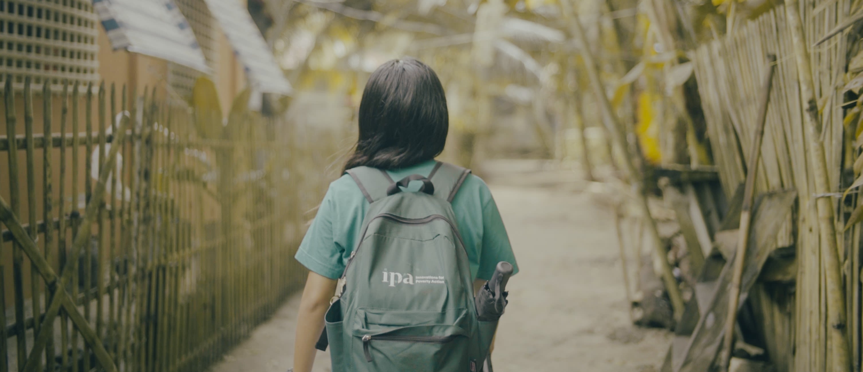 An enumerator for the Philippines Socioeconomic Panel Survey (PSPS) photographed on their way to survey respondents. © 2024 First Light Studios & IPA Philippines