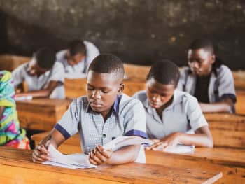 Students sit at their desks while taking a STARS learning assessment. © 2023 IPA / Timeless Studios