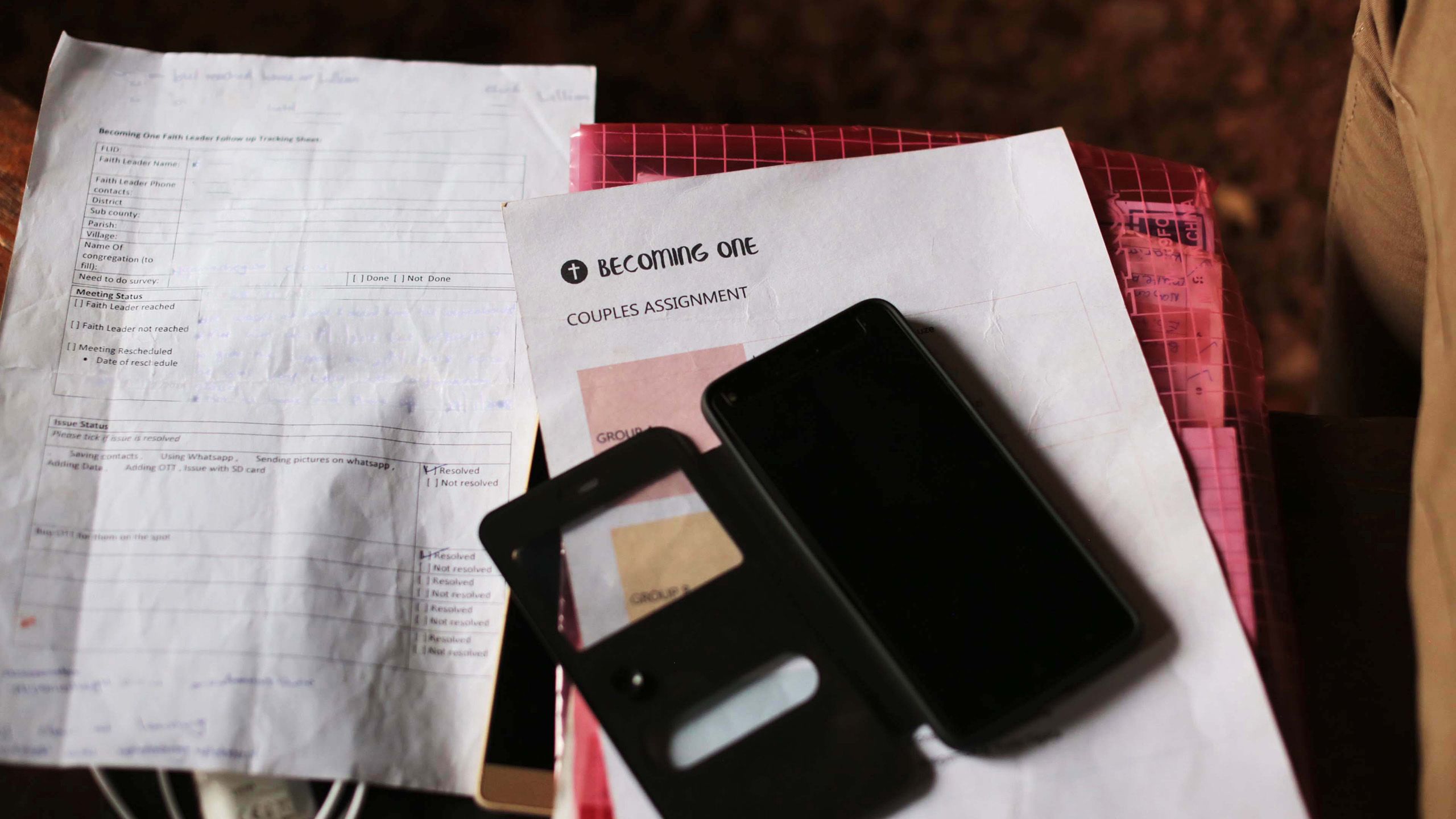 Becoming One survey forms placed on top of a table